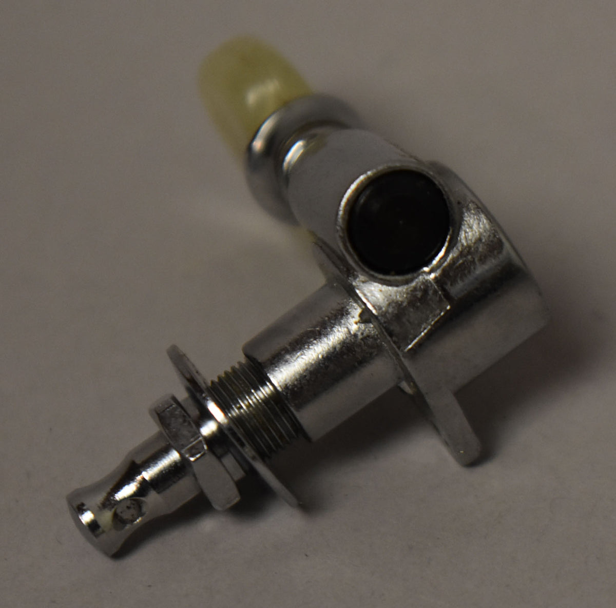 A single chrome tuner with a yellowed pearl button, viewed from the side, showing the threaded shaft, nut, and washer.