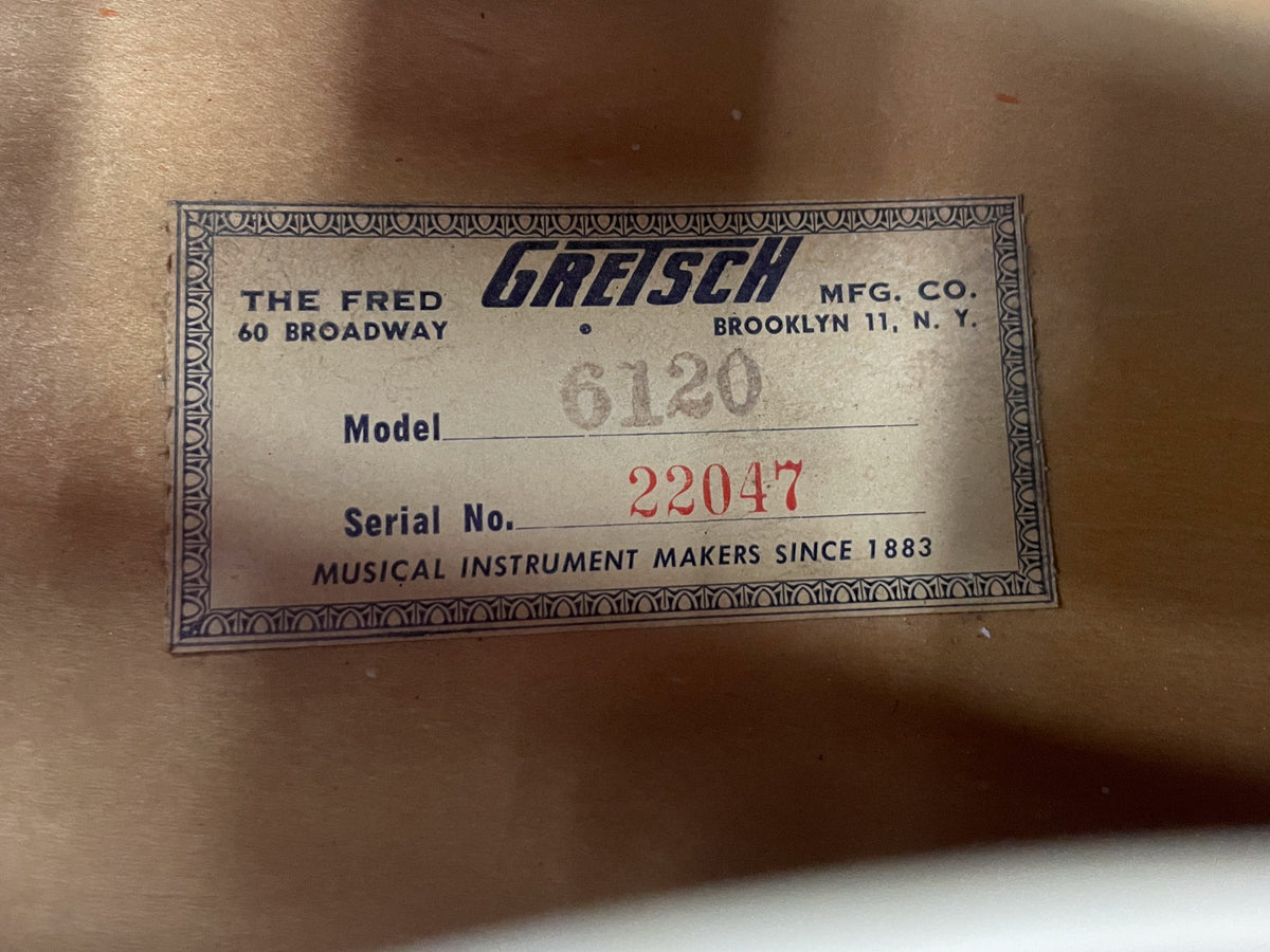 Close-up of the guitar's interior label, showing "Model 6120" and "Serial No. 22047" handwritten in red ink.