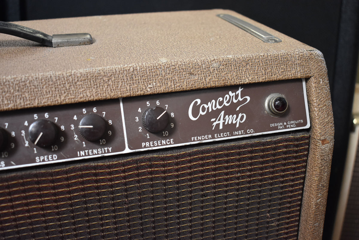 Close-up of the amp's top right, showing the brown control panel with black knobs, a red pilot light, and tan textured tolex.