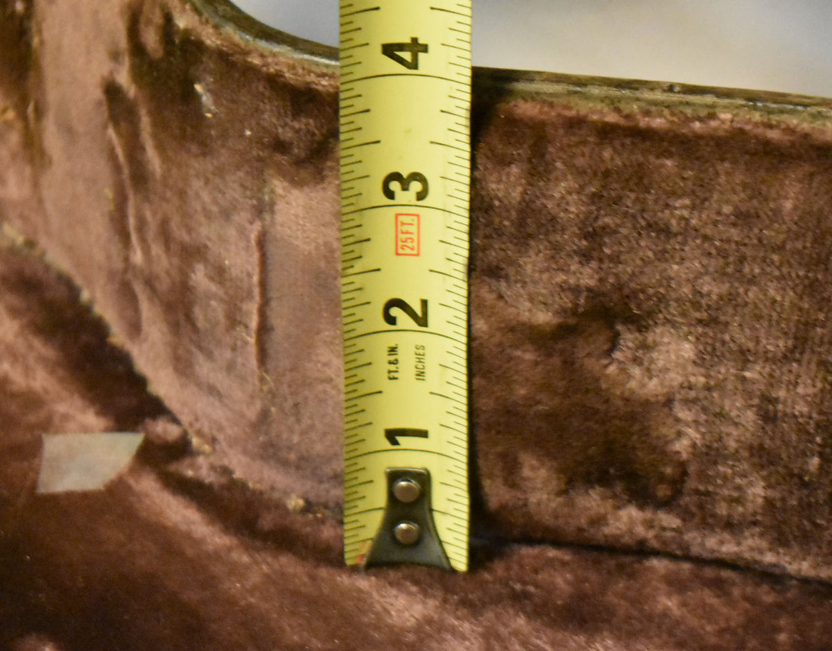 Close-up of the case's brown plush interior, showing a tape measure indicating a depth of approximately 3.5 inches.