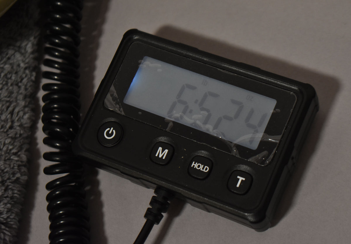 Digital scale display reading 6 lb 5.24 oz, the weight of this 1963 Fender Musicmaster White Refin Pre-CBS.