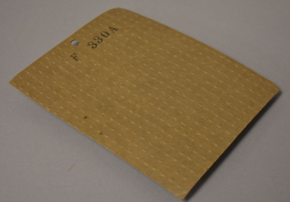 A tan, textured paper tag with a punched hole and "F 330A" printed in the upper left corner.