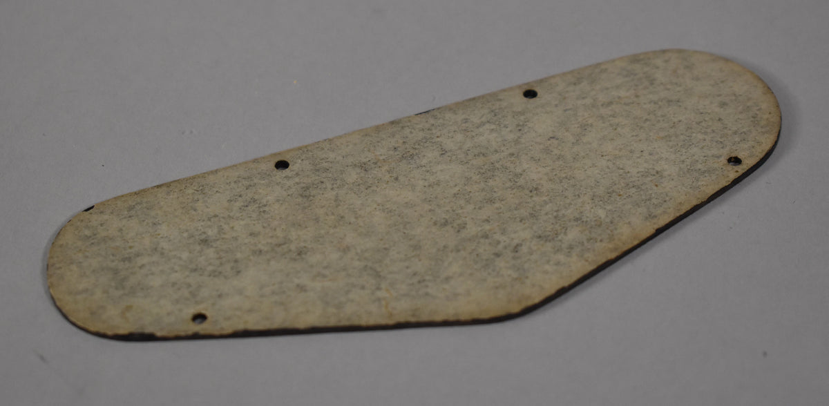 The black plastic back plate, viewed from the reverse, has a textured, slightly discolored surface and three visible screw holes.