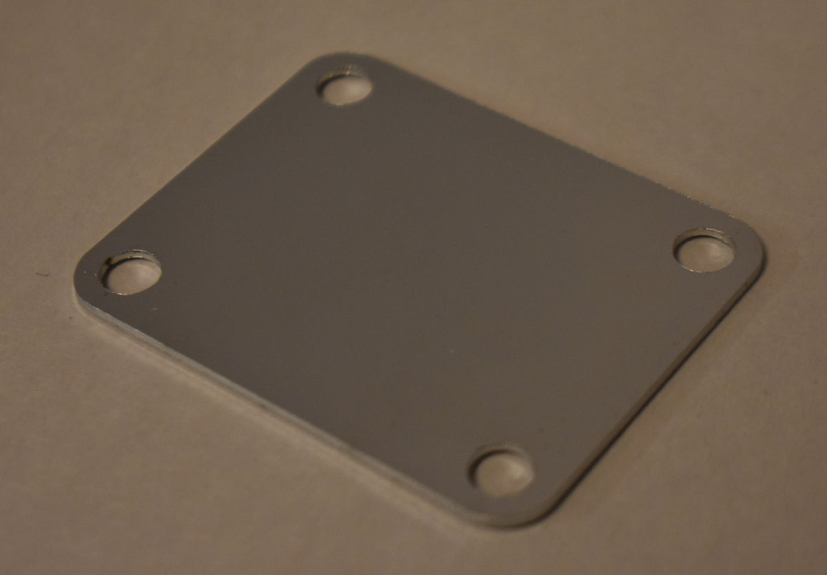 A chrome neck plate with a matte finish, viewed from a slight angle, showing four screw holes and no visible wear.