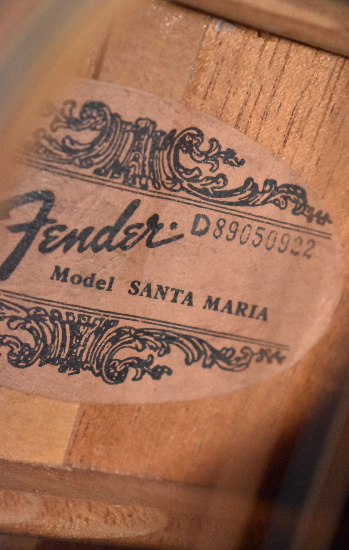 A close-up of the guitar's interior label, showing "Fender" and "Model SANTA MARIA" in black script on a light brown paper label.
