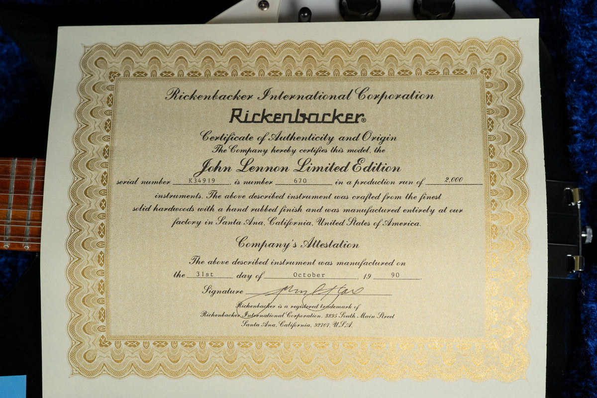 Close-up of the guitar's Certificate of Authenticity, showing serial number K34919 and production number 670 of 2,000.