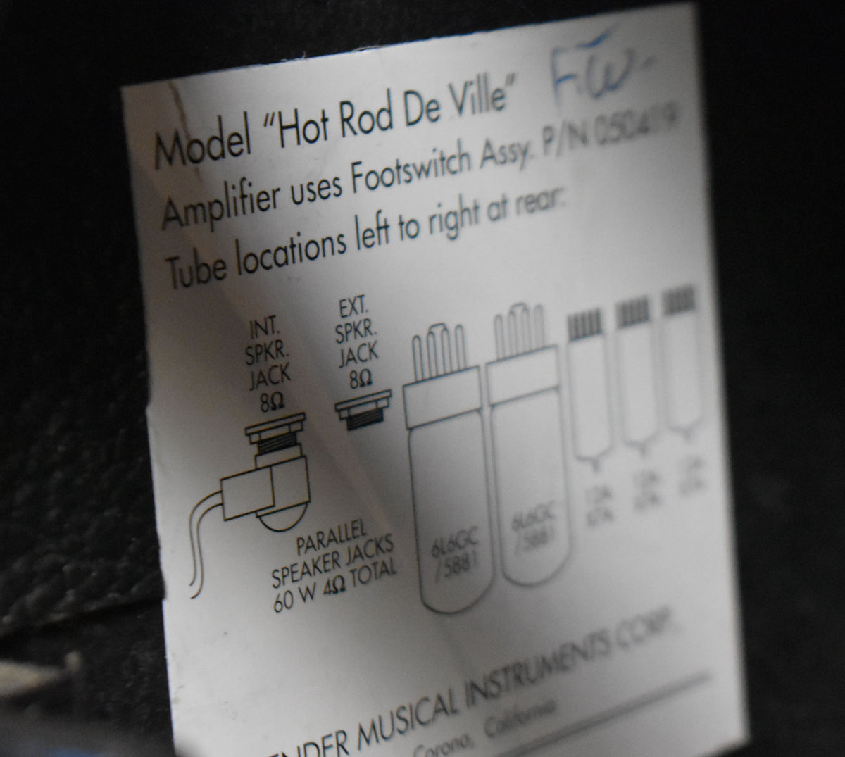 A close-up of the amp's white paper label, showing diagrams for speaker jacks and tube locations, with some creasing visible.