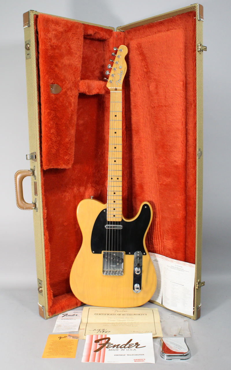 Butterscotch blonde Telecaster with black pickguard and maple neck, resting in a tweed case with orange plush lining.