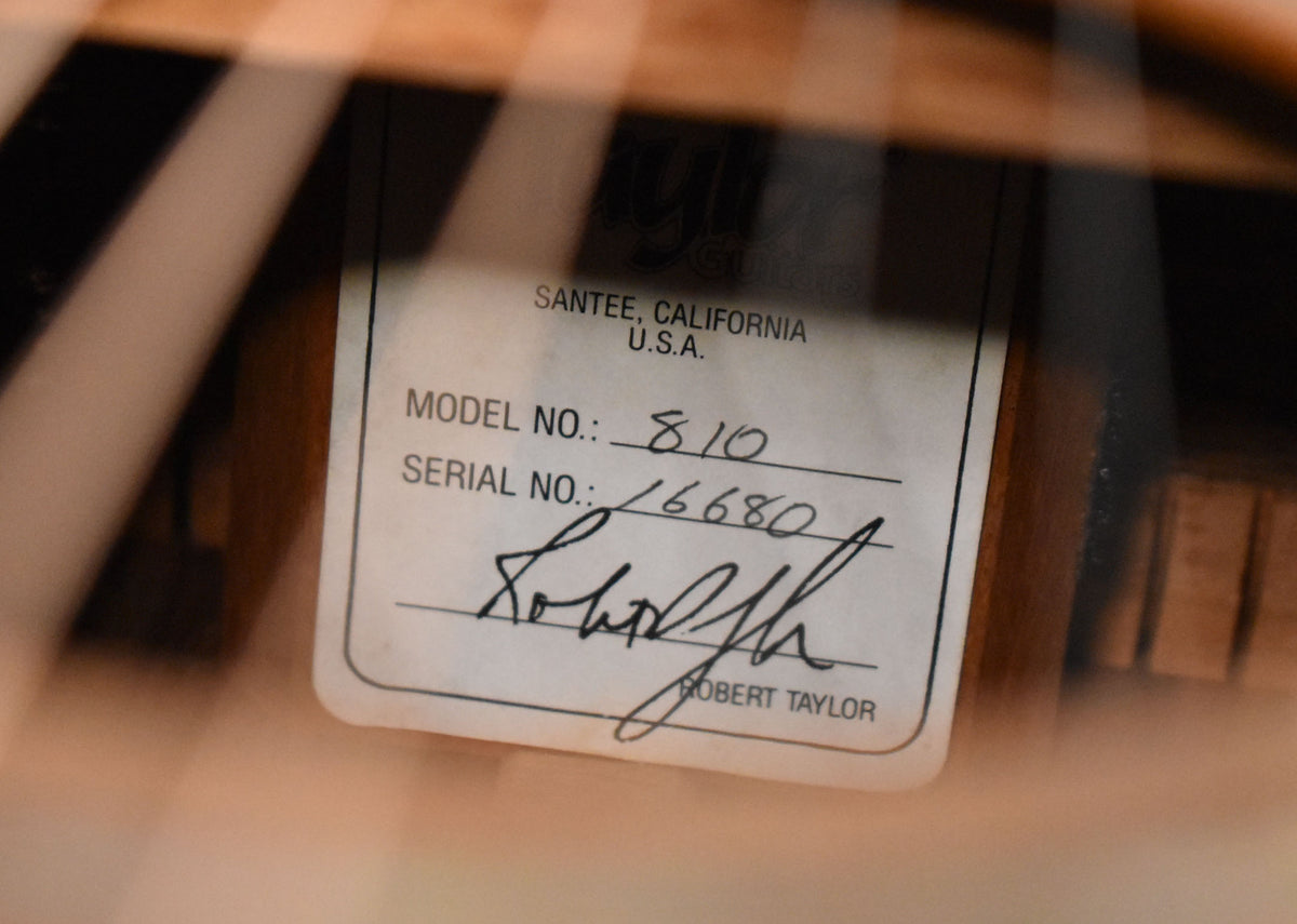 A close-up of the guitar's interior label, showing "MODEL NO.: 810" and "SERIAL NO.: 16680" handwritten, with a signature.