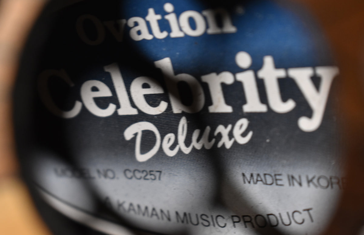 A close-up of the guitar's interior label, showing "MODEL NO. CC257" and "MADE IN KOREA" on a dark blue background.