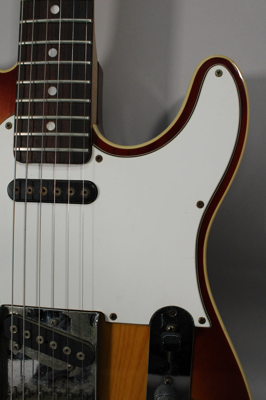 Close-up of the guitar's upper body, showing the fretboard, white pickguard, neck pickup, and part of the bridge pickup.