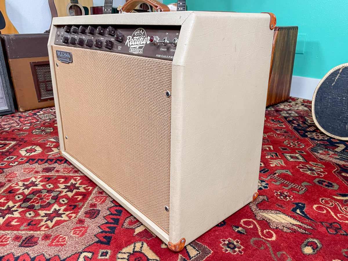 Cream-colored combo amp, angled to show the front and right side, with a tan grille cloth and brown control panel.