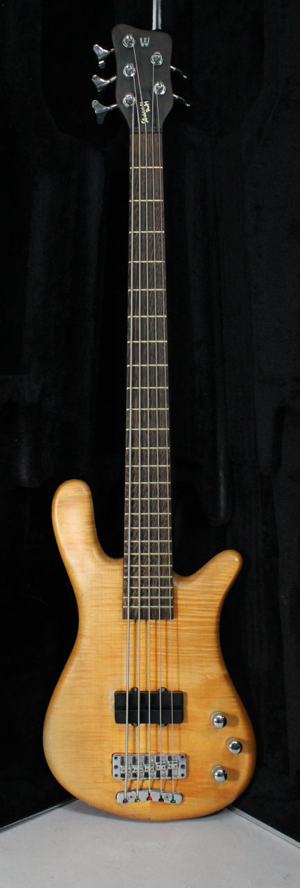 Full-length view of a natural transparent satin finish bass with a dark fretboard, two black pickups, and three chrome control knobs.