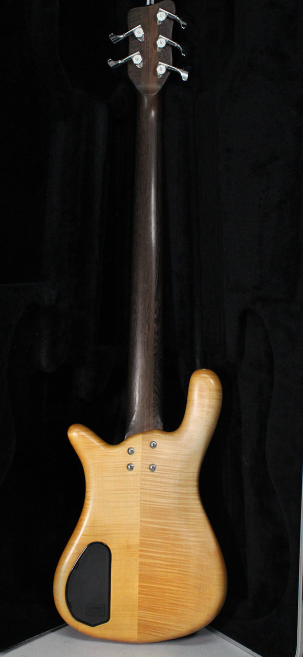 The bass's back is shown, revealing a natural transparent satin finish with prominent wood grain and a black control cavity cover.