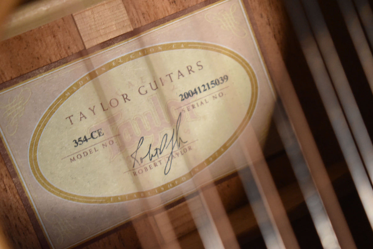 Close-up of the guitar's interior label, showing the model number 354-CE, serial number 20041215039, and a signature.