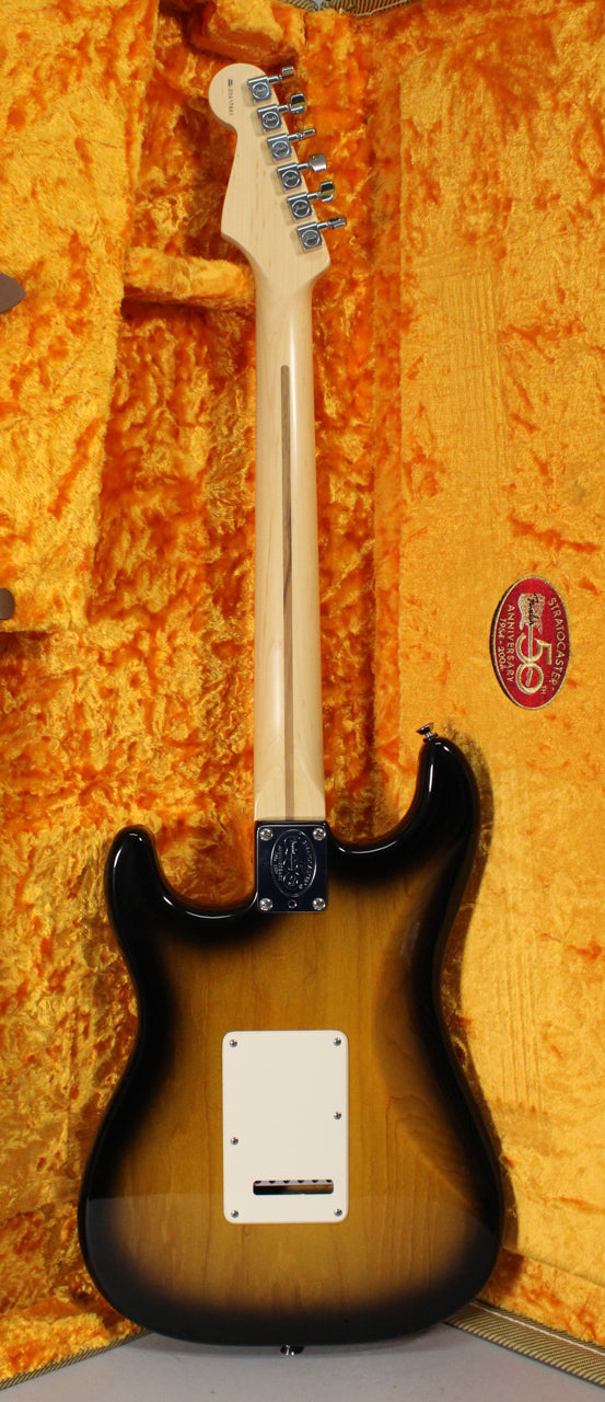 The guitar's back, neck, and headstock are visible, showing a 2-color sunburst finish, a light wood neck, and a white tremolo cover.