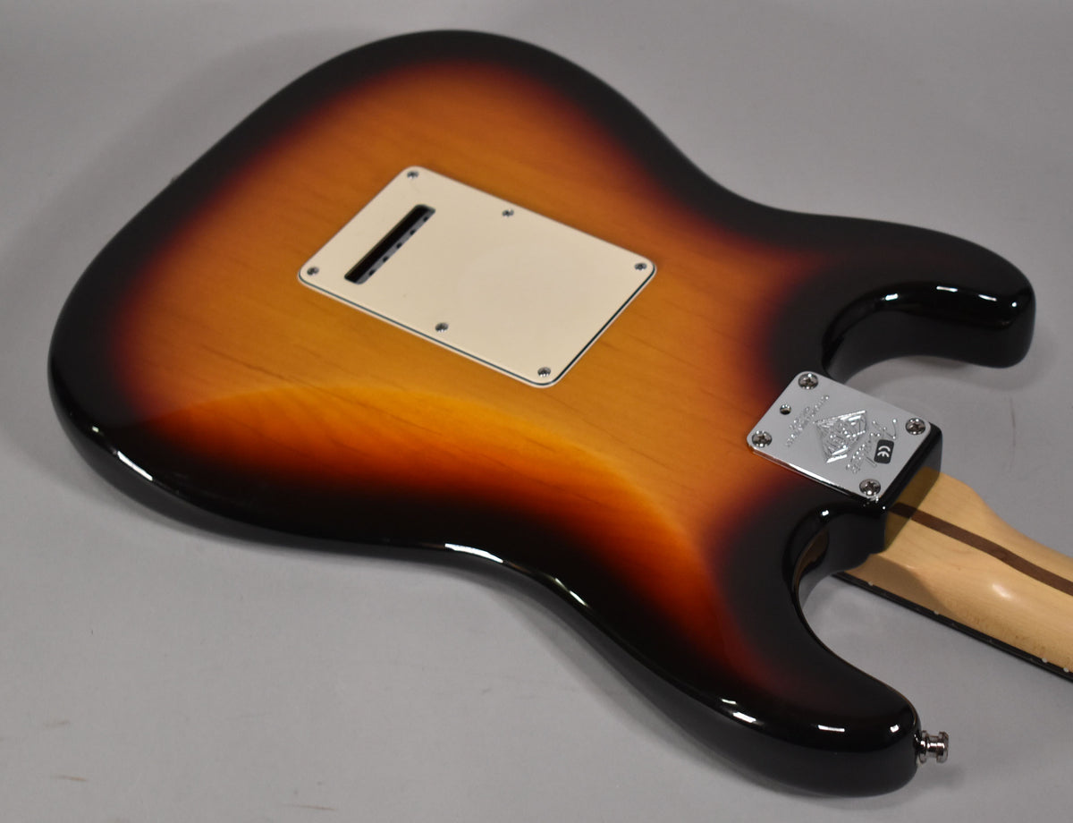 The guitar's sunburst back shows a cream tremolo cover and a chrome neck plate with an embossed 60th Anniversary logo.