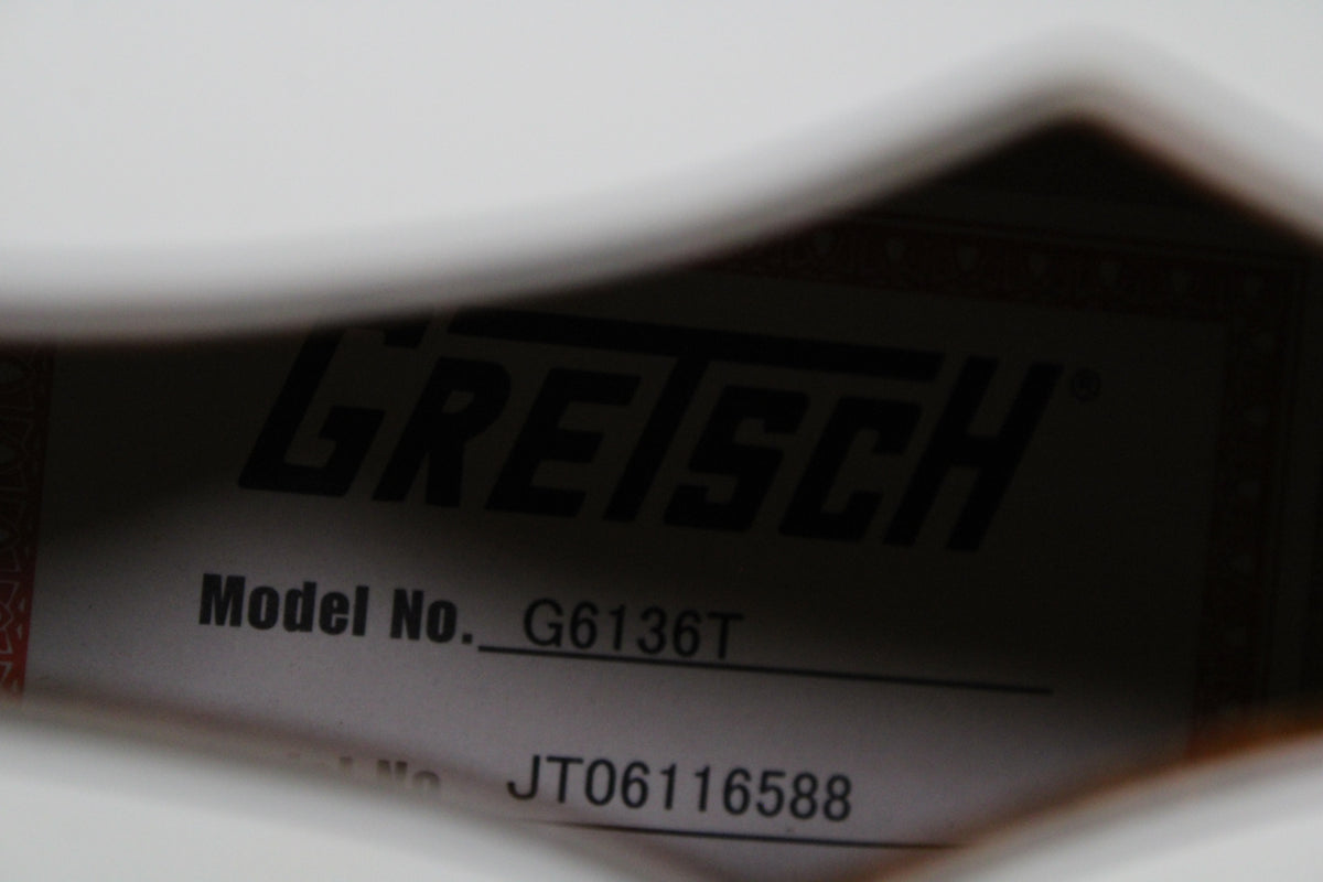 Close-up of the guitar's interior label, showing "GRETSCH" and "Model No. G6136T" in black text on a white label.