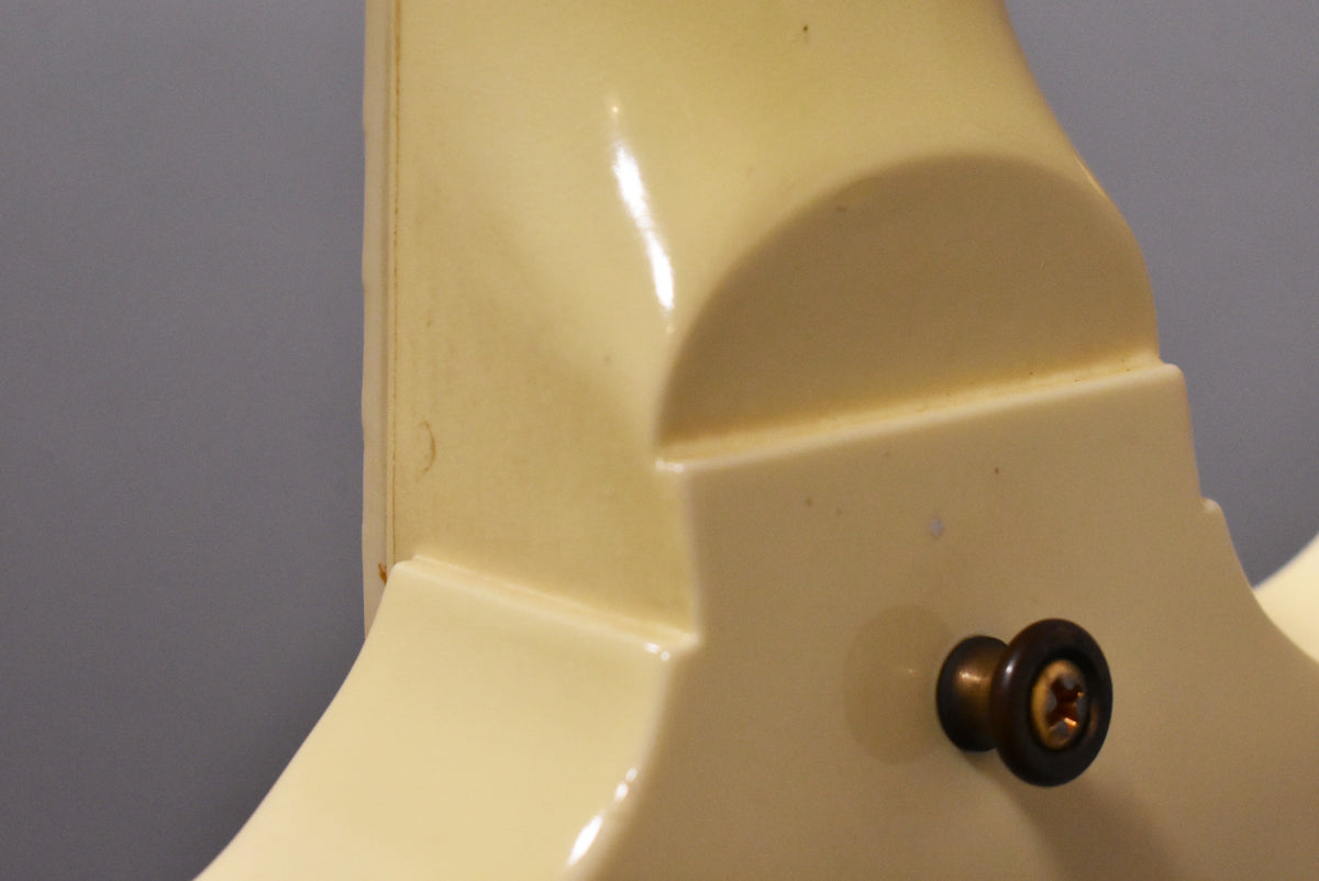 Close-up of the guitar's neck heel and upper body in aged Alpine White, showing a strap button and light finish checking.