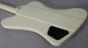 The back of an Alpine White Firebird V, showing the neck joint, control cavity cover, and strap button.