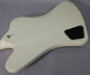 The back of an Alpine White Firebird V, showing the control cavity cover and output jack, with minor surface wear.