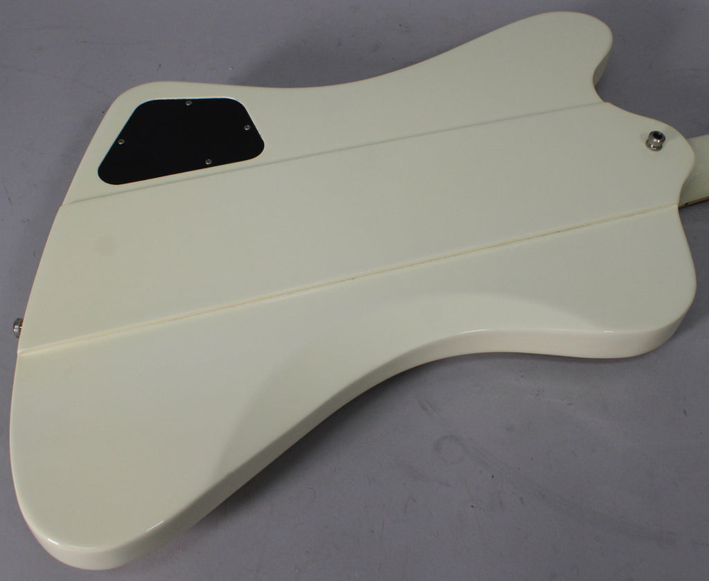 The back of the glossy Alpine White Firebird body, showing the black control cavity cover and the neck-through construction.
