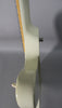 Side view of the Alpine White Firebird's neck heel and upper body, showing finish checking around the neck joint and a strap button.