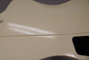 Close-up of the guitar's glossy Alpine White back, showing a subtle seam line and a black control cavity cover with four screws.