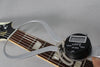 A digital caliper measures the guitar's nut width at 1.71 inches, with the headstock and fretboard visible.