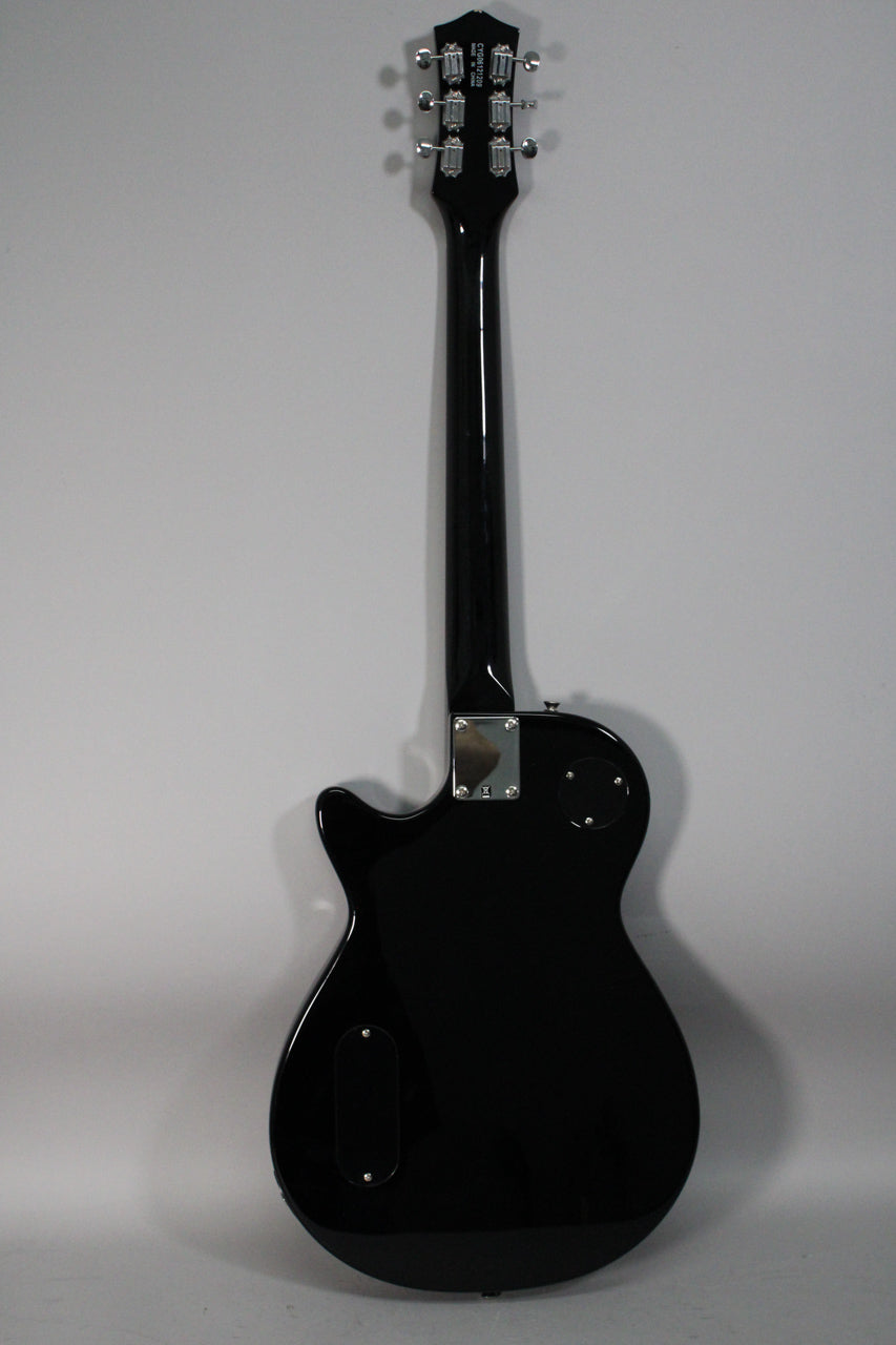 Full rear view of a black electric guitar with a glossy finish, chrome tuners, and control cavity covers.
