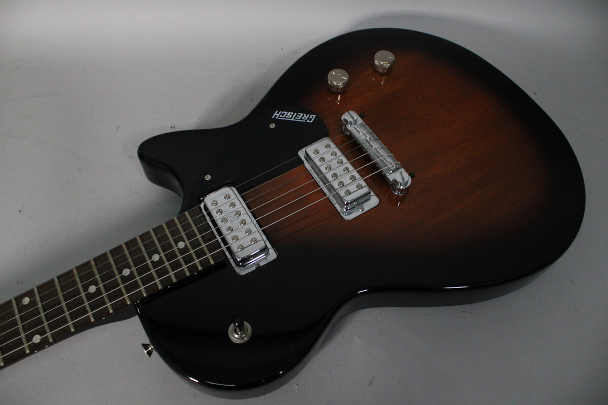 The tobacco sunburst guitar body is angled from the neck, showing two chrome humbuckers, a tune-o-matic bridge, and two control knobs.
