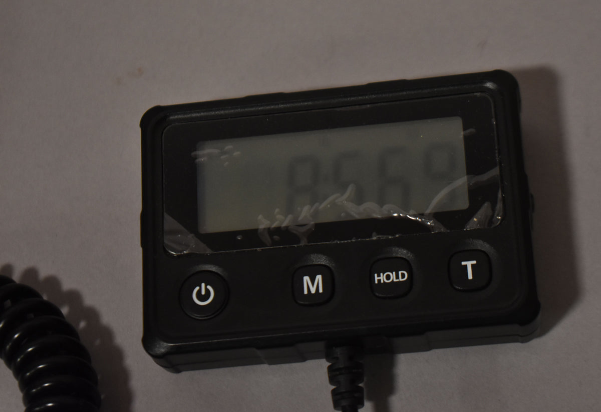 Digital scale display reading 8 lb 5.69 oz, the weight of this 2009 Epiphone Les Paul Standard Ebony.