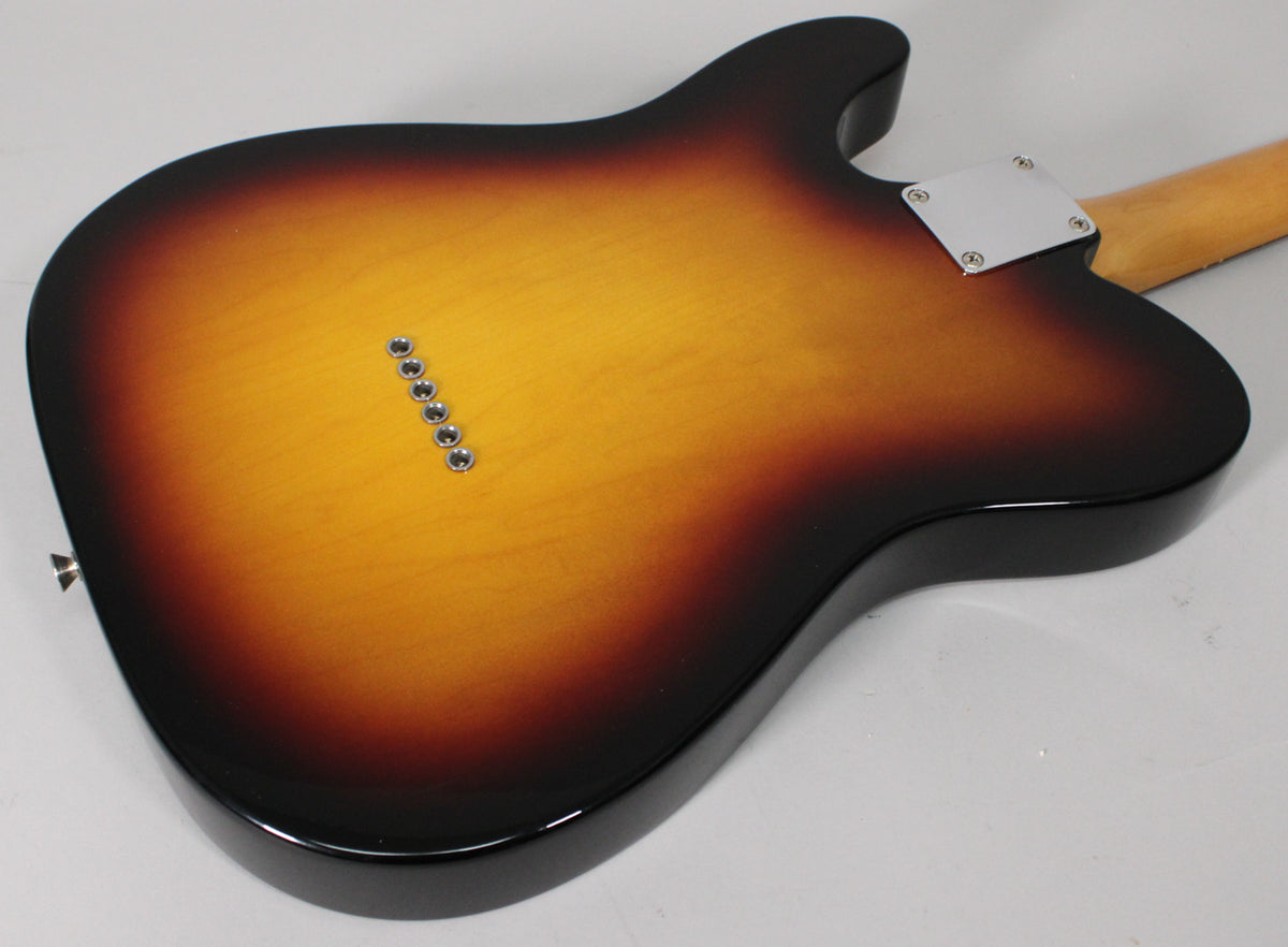 The back of a sunburst Telecaster-style guitar, showing six string-through-body ferrules and a chrome neck plate.