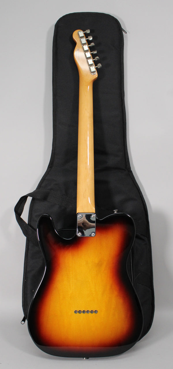 The back of a sunburst Telecaster-style guitar, showing the neck, headstock with six tuners, and string-through-body ferrules.