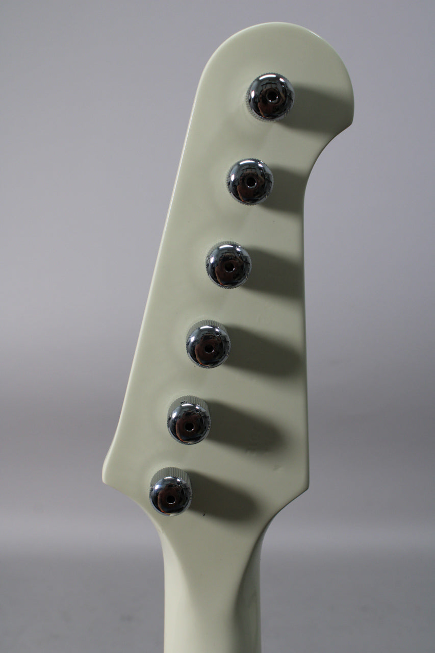 Close-up of the white headstock, angled slightly to the right, showing six chrome tuners in a straight line down the left side.