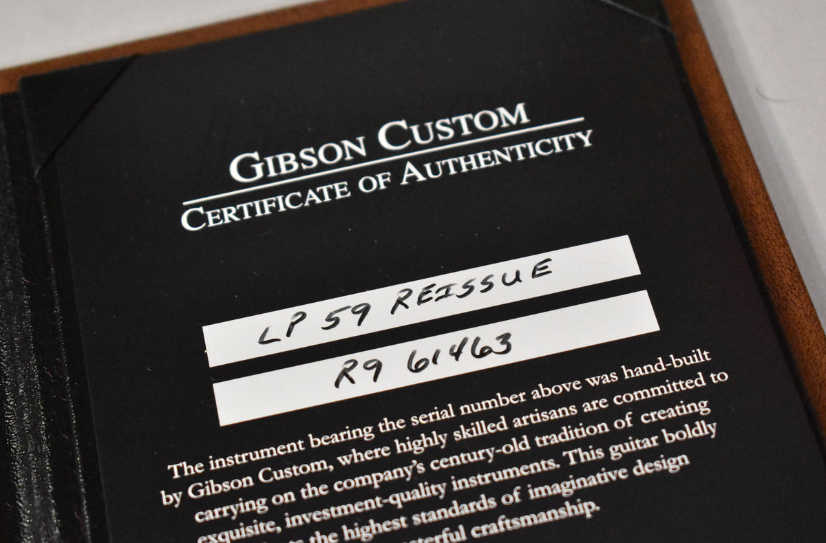 Close-up of the black Certificate of Authenticity, showing handwritten "LP 59 REISSUE" and "R9 61463" on white labels.