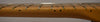 Close-up of the maple fretboard and frets, showing black dot inlays and some light wear along the lower edge.