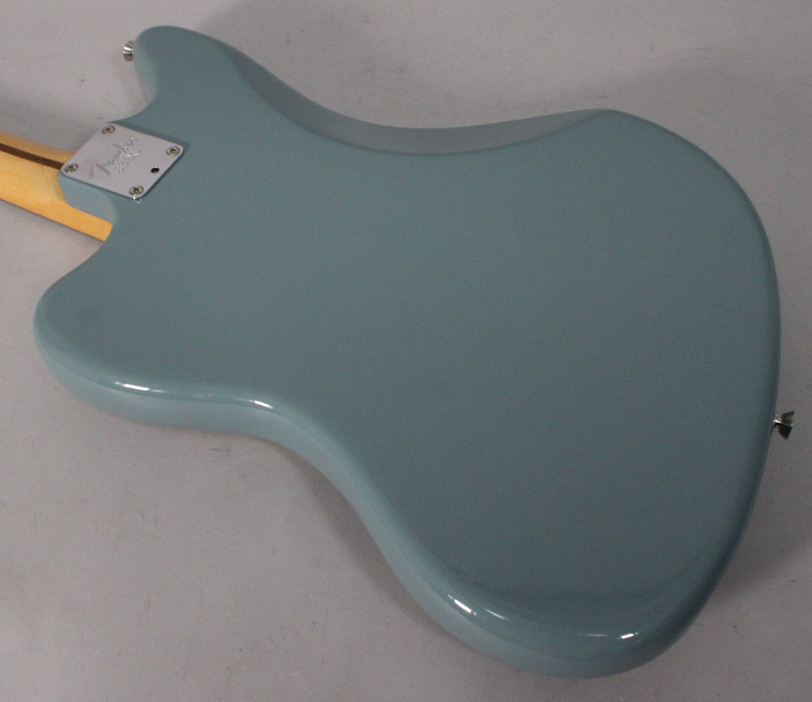 The back of a glossy sonic grey Jaguar body, angled from the neck joint to the lower bout, with a chrome neck plate.