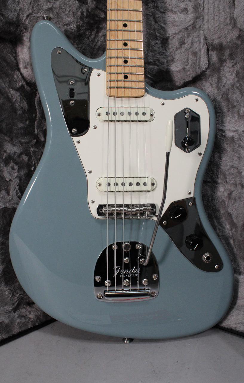 Full view of a Sonic Grey Jaguar electric guitar with a white pickguard, chrome hardware, and a maple fretboard.