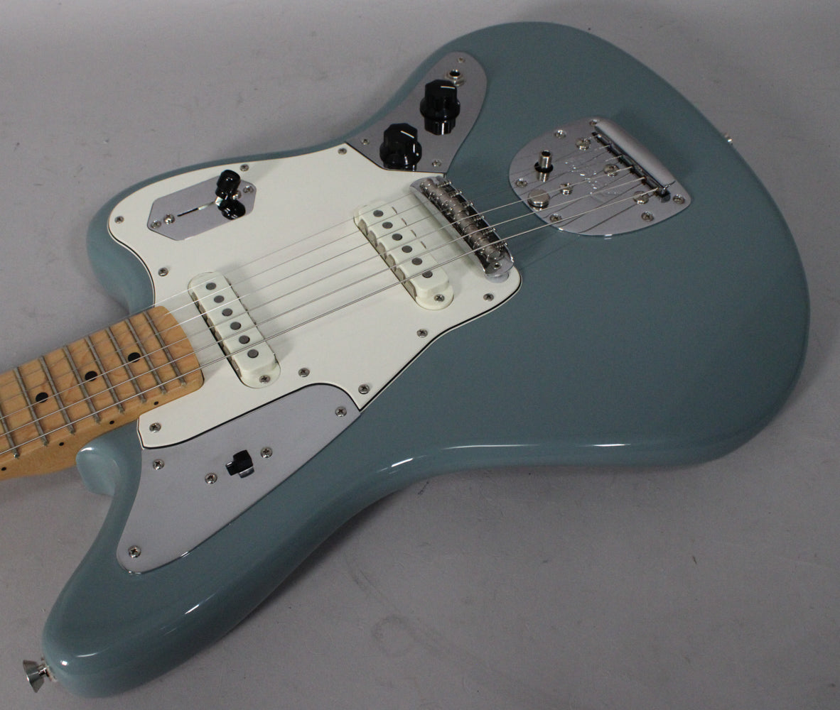 Sonic Grey Jaguar body with white pickguard, chrome hardware, two white single-coil pickups, and a maple neck, viewed from above.