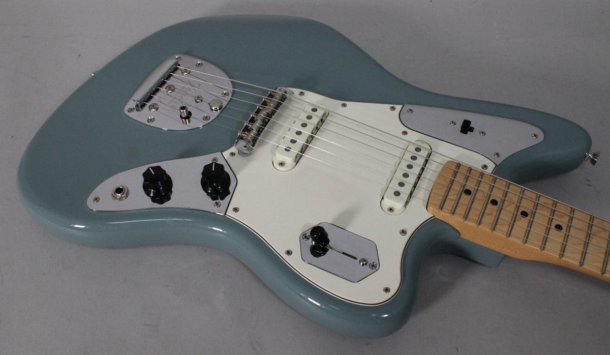Overhead view of a sonic grey guitar with a white pickguard, chrome hardware, two single-coil pickups, and a maple fretboard.
