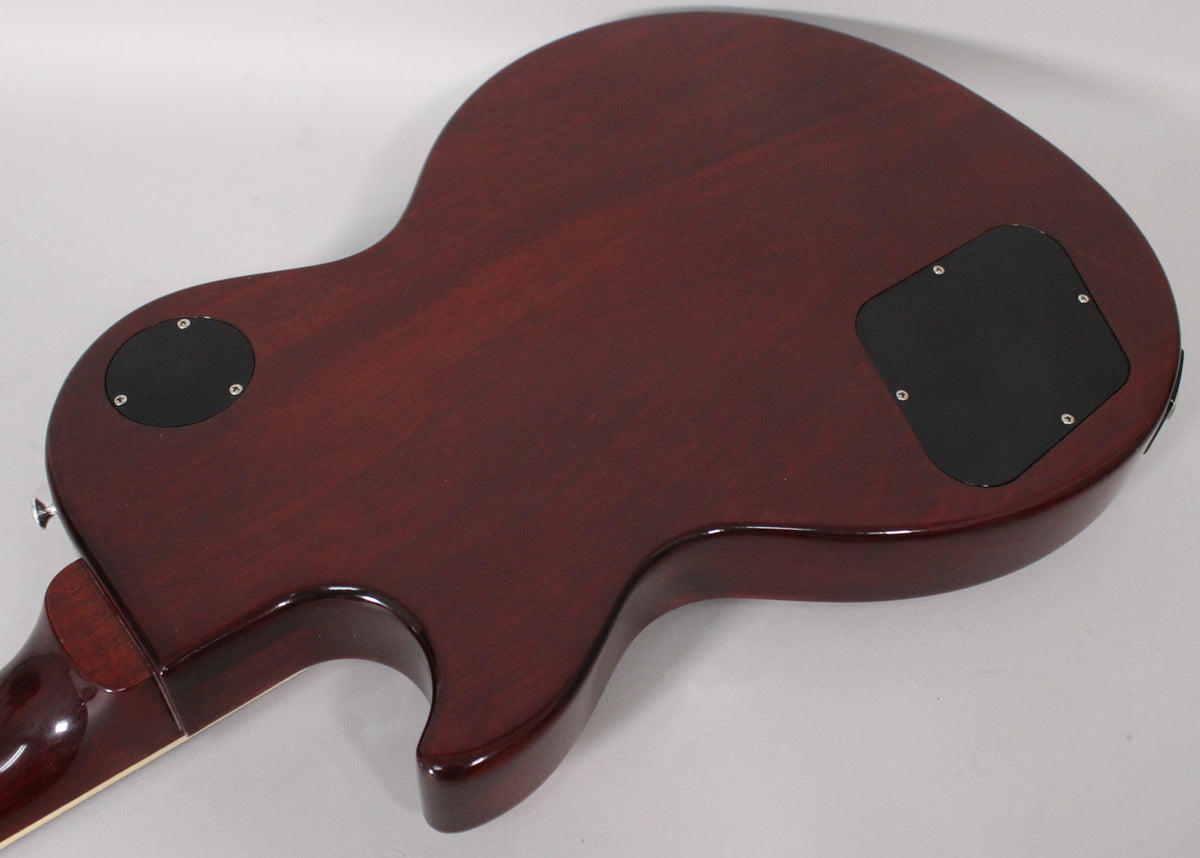 The back of the dark cherry guitar body, showing the neck joint, two black control cavity covers, and a glossy finish.
