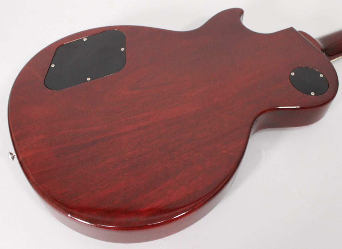 The back of a dark cherry guitar with a glossy finish, showing two black control cavity covers and visible wood grain.