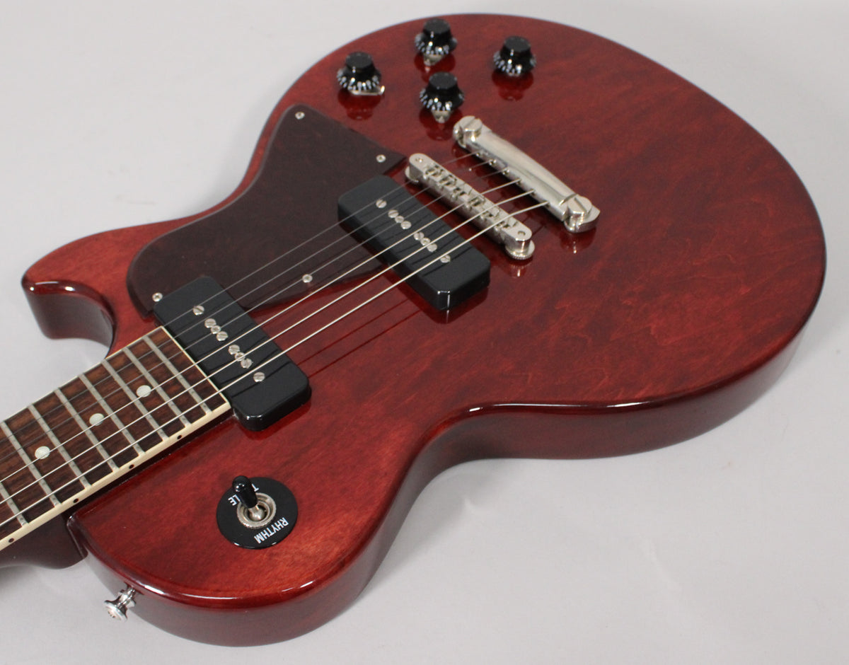 Dark cherry Les Paul Special, angled from the lower bout, showing two black P90 pickups, four black knobs, and a chrome bridge.