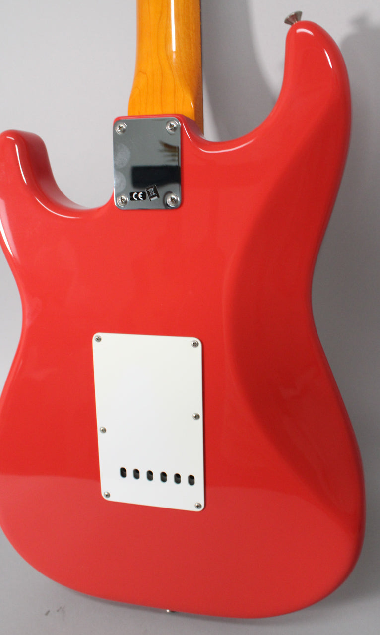 The back of a glossy Fiesta Red Stratocaster body, with a white tremolo cover and a chrome neck plate.