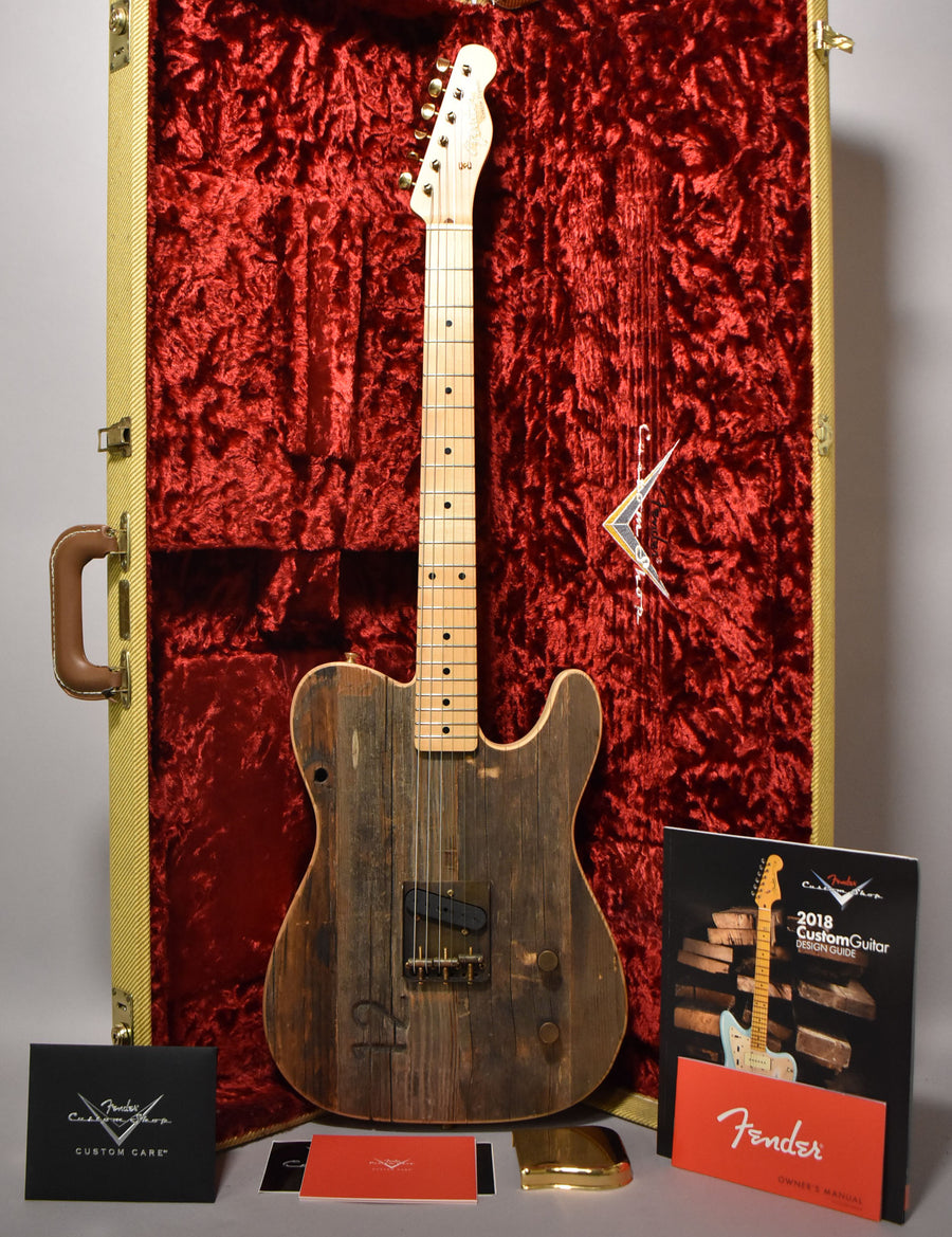 Full-length view of a distressed wooden Esquire with a maple neck, brass hardware, and a tweed case with red crushed velvet lining.