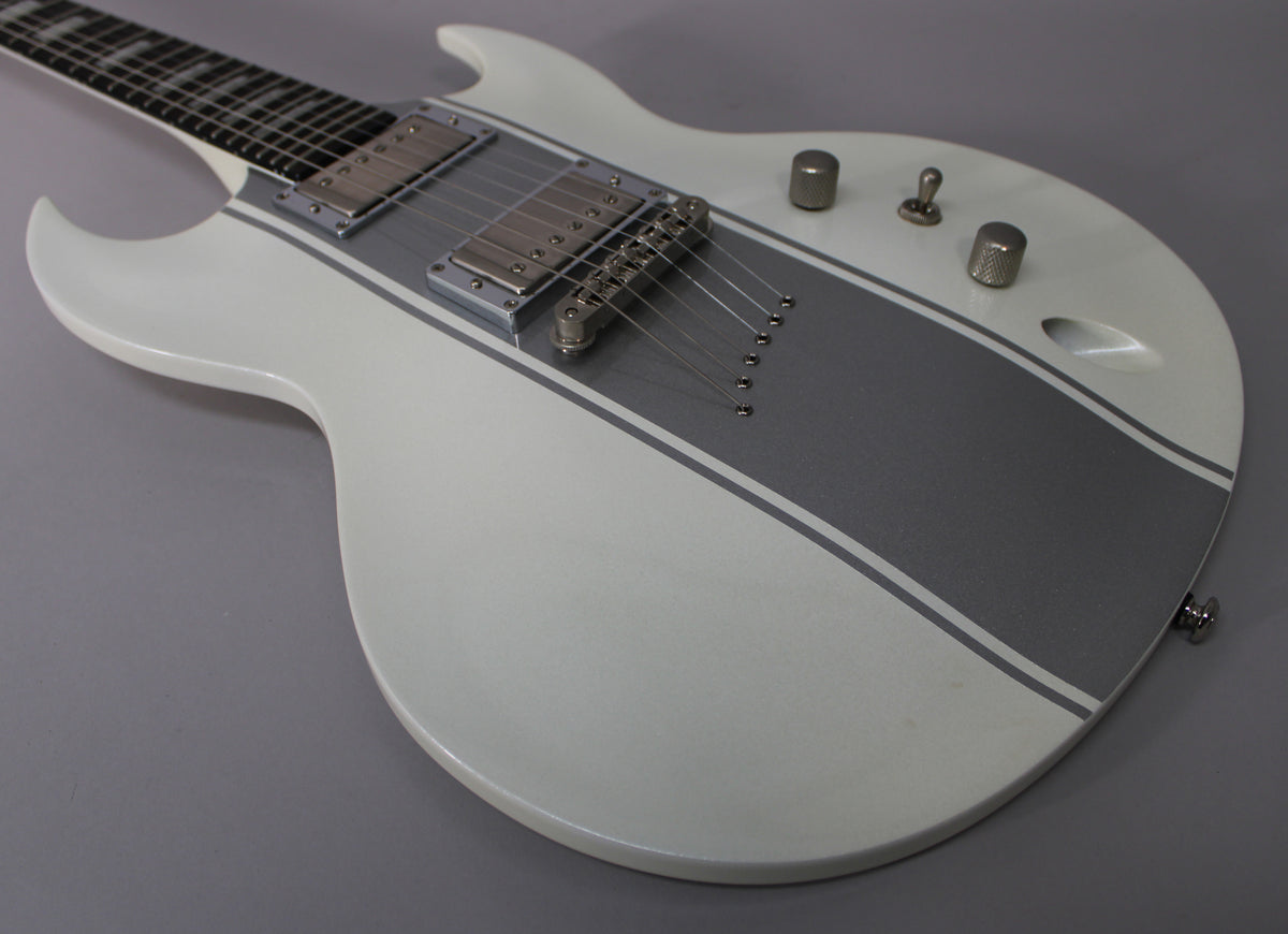 White electric guitar body with a wide silver stripe and thin silver outlines, two humbuckers, and three chrome knobs.