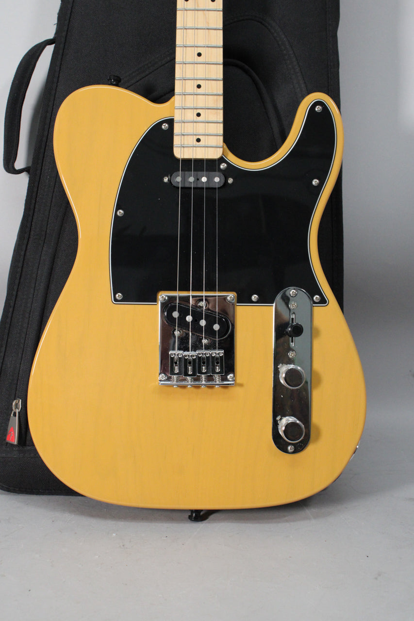 Full front view of a butterscotch blonde Telecaster-style guitar with a black pickguard, chrome hardware, and a maple fretboard.