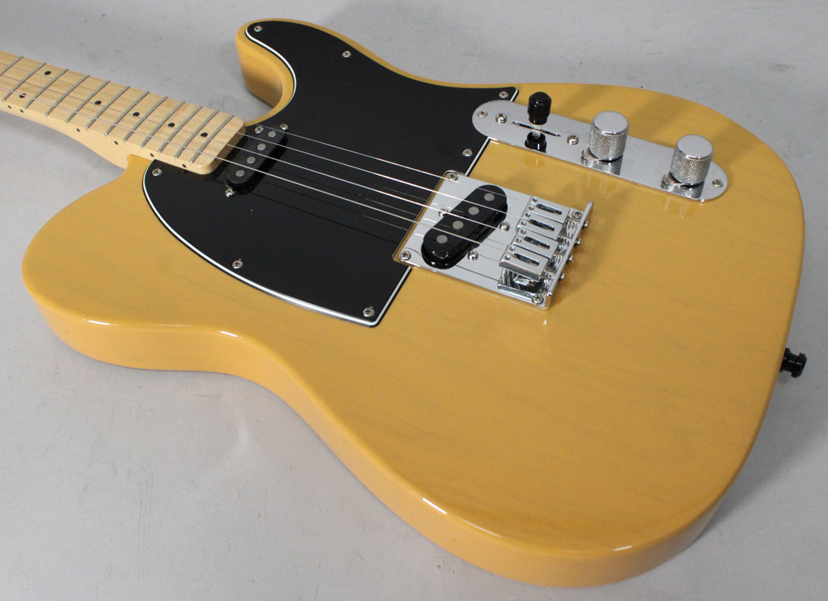 The butterscotch blonde Telecaster body is angled, showing its black pickguard, two single-coil pickups, and chrome hardware.