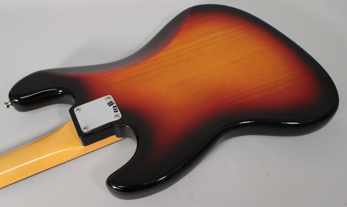 The back of a 3-color sunburst bass, showing the glossy body, light wood neck, and a chrome neck plate with visible screws.